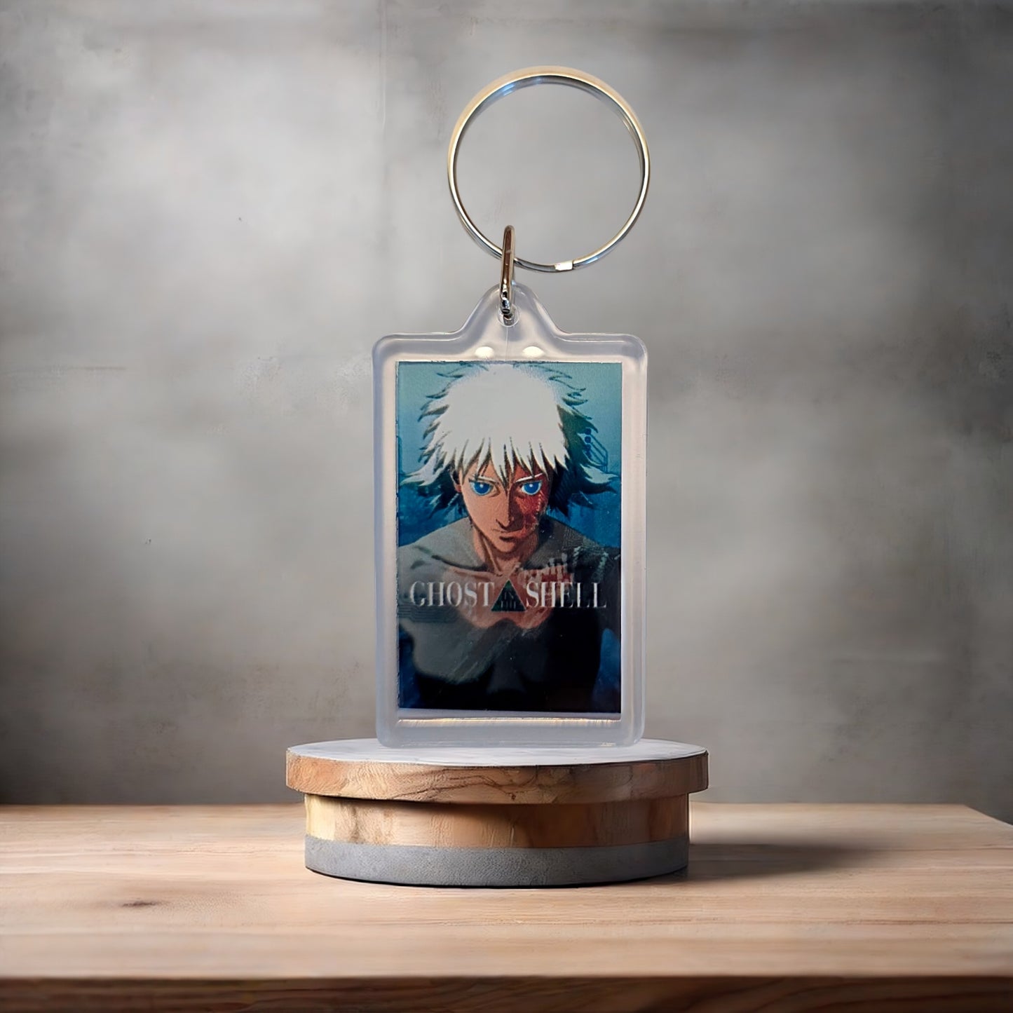 Ghost in the Shell anime keychain with metal prints encased.
