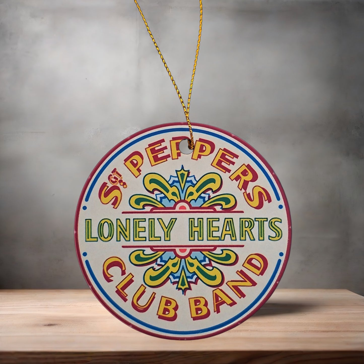 The Beatles Sgt Peppers Lonely Hearts Club band Christmas ornament , 3" round ceramic.