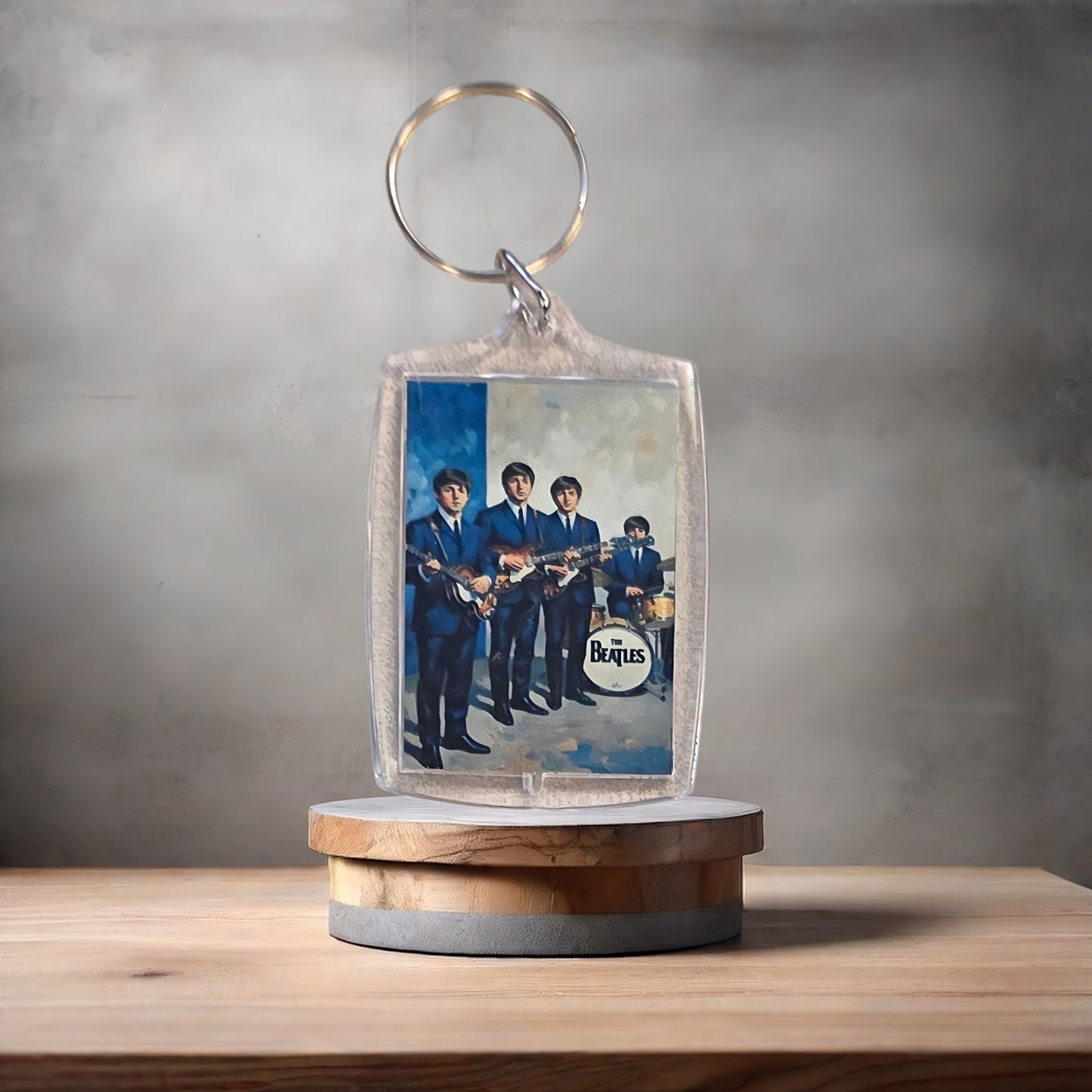 The Beatles poster keychain on 2 aluminum prints.