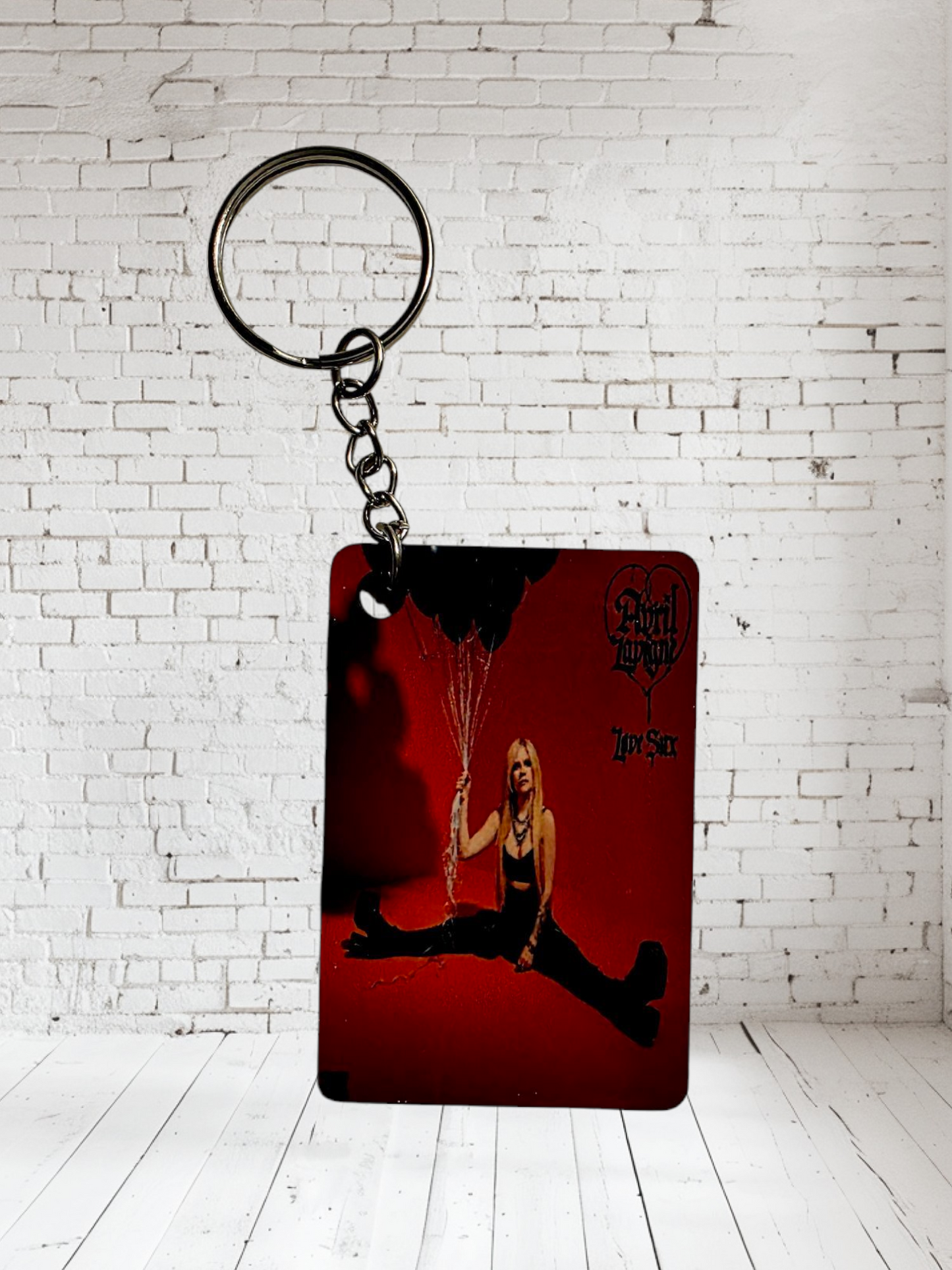 Avril Lavigne concert poster and album cover keychains. Multiple designs to choose from