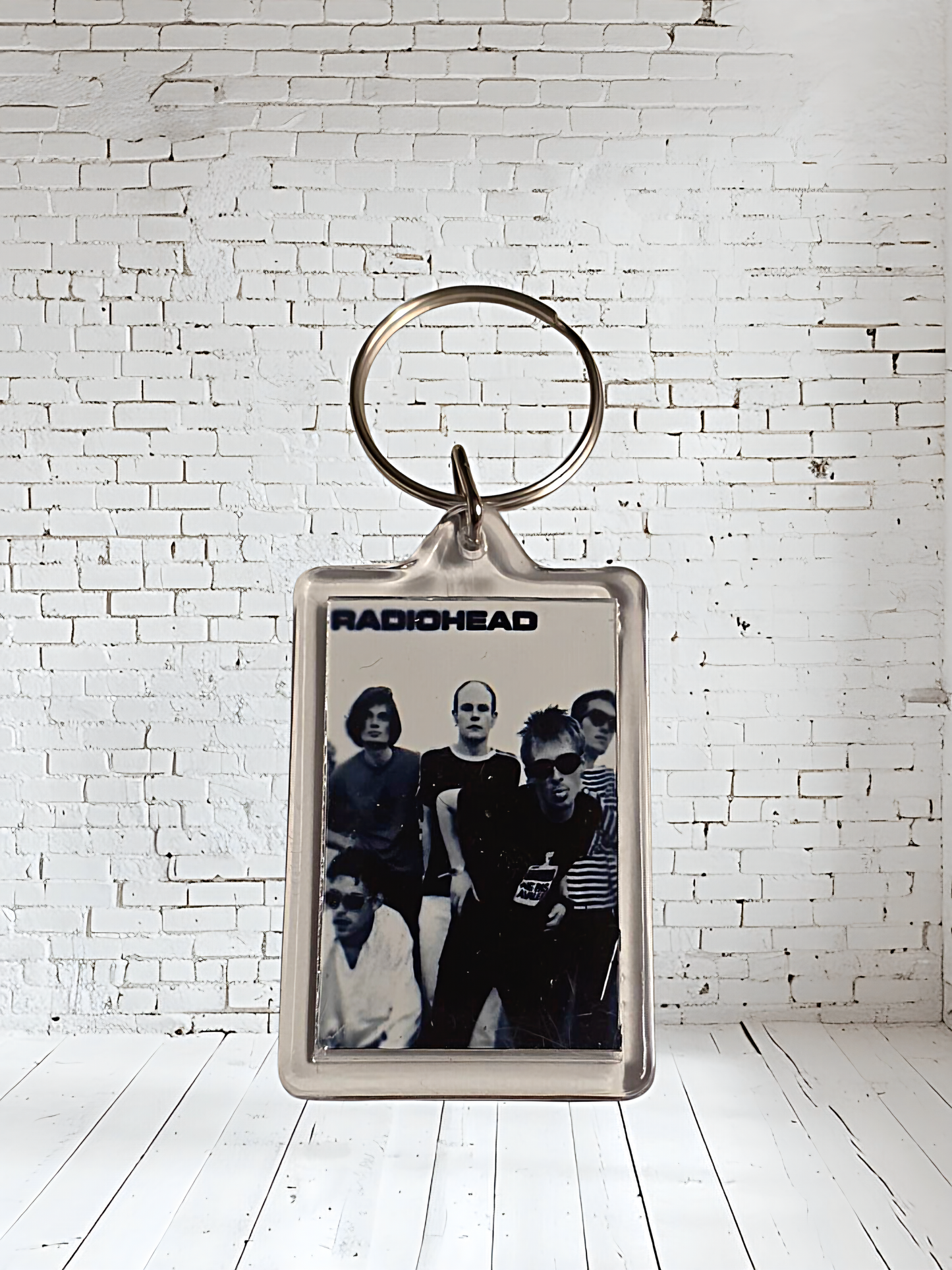 Radiohead concert and album cover keychains with metal prints encased. Plenty to choose from