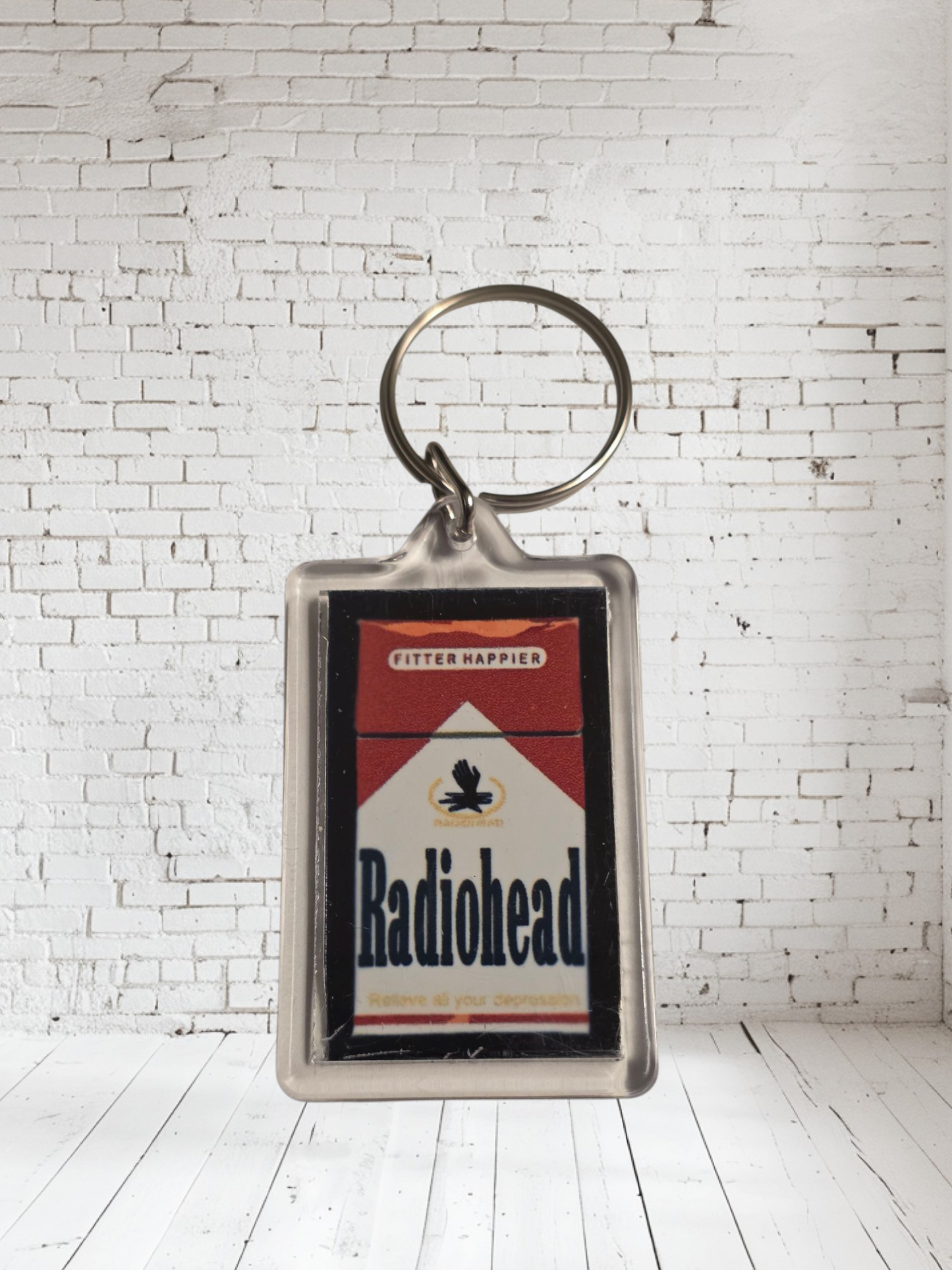 Radiohead concert and album cover keychains with metal prints encased. Plenty to choose from