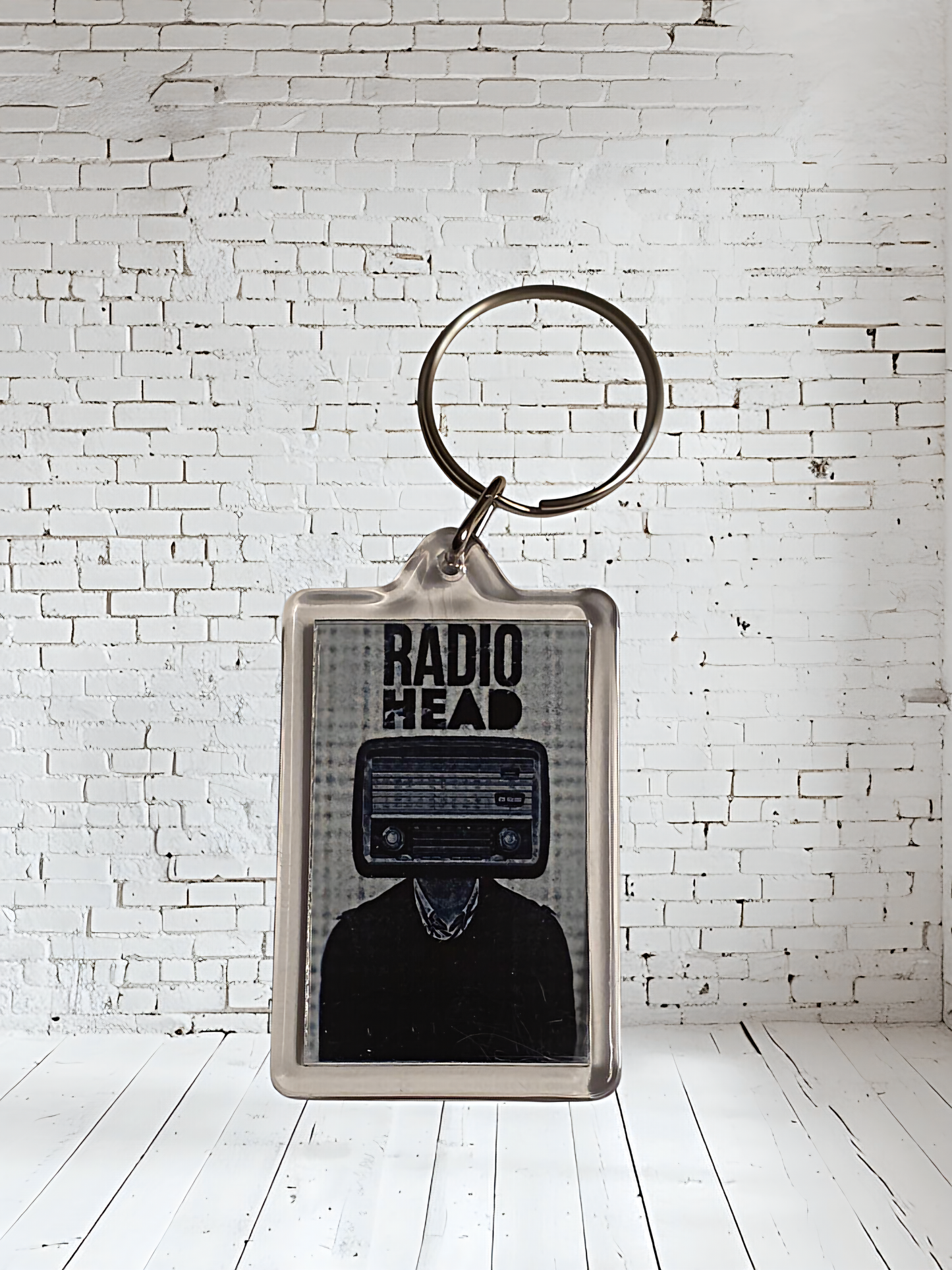 Radiohead concert and album cover keychains with metal prints encased. Plenty to choose from