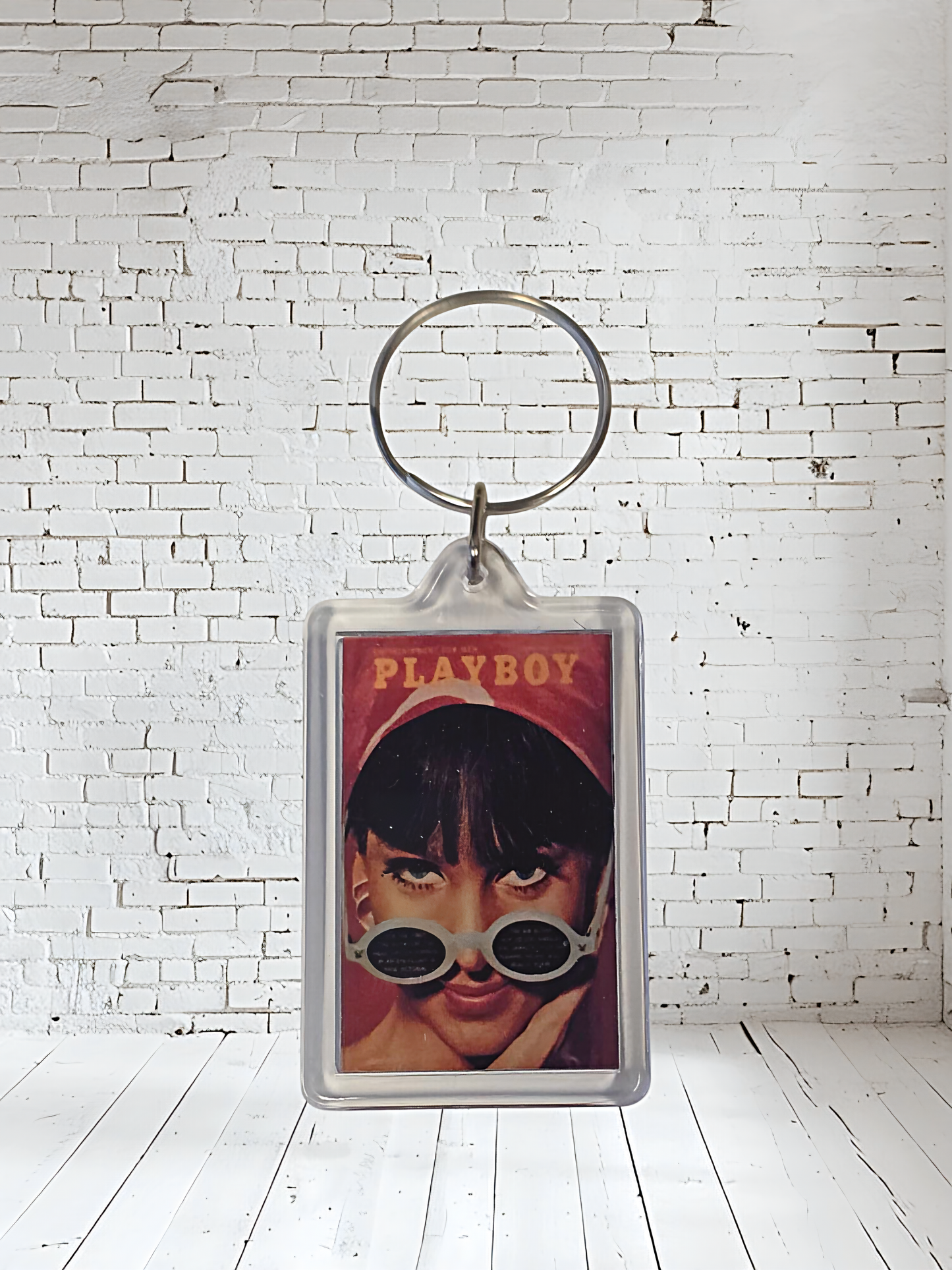 Playboy magazine cover keychains with metal prints encased. Plenty to choose from
