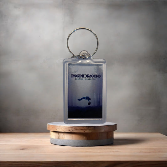 Imagine Dragons Continued Silence album cover keychain with metal prints encased. Plenty to choose from