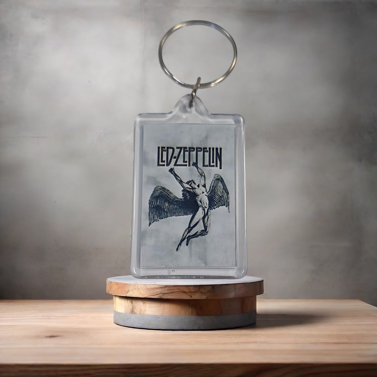 Led Zeppelin Swan Song poster keychain with metal prints encased. Plenty to choose from