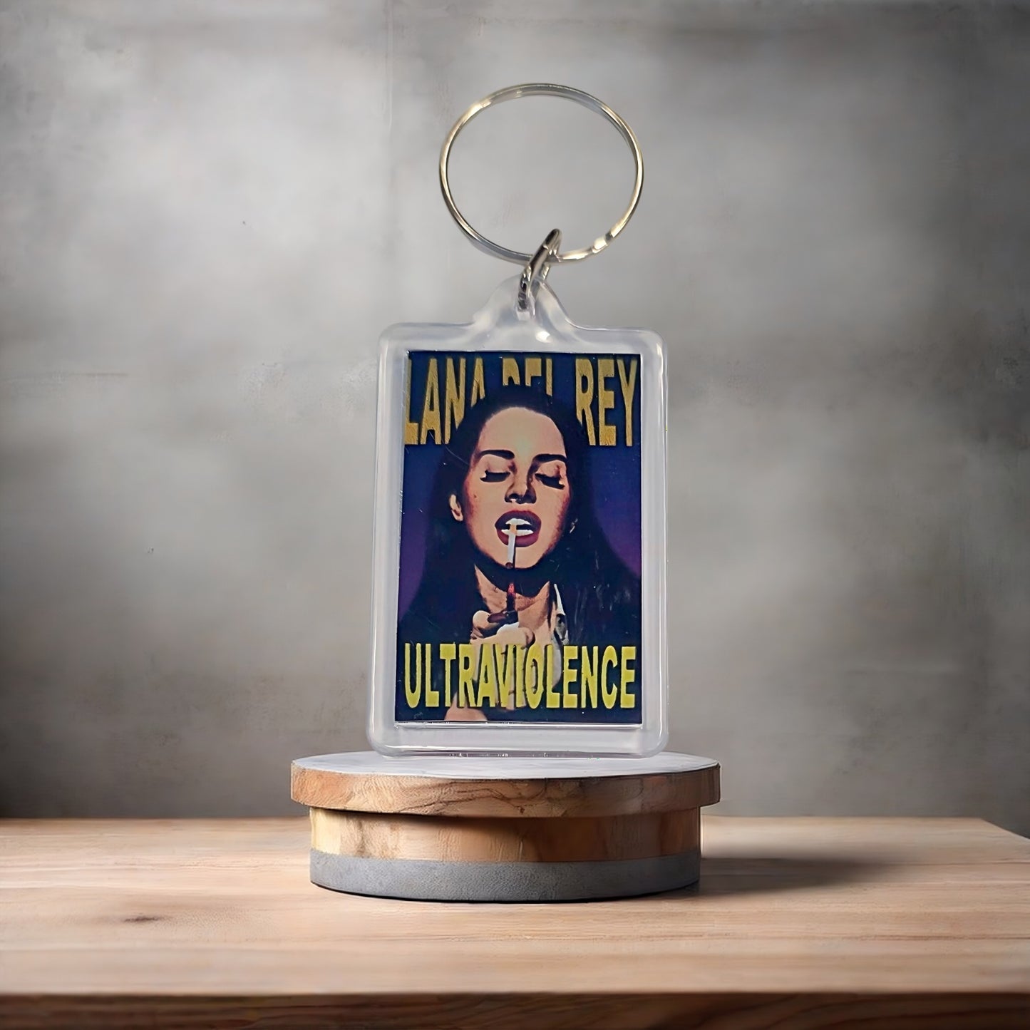 Lana Del Rey Ultraviolence poster keychain with metal prints encased. Plenty to choose from