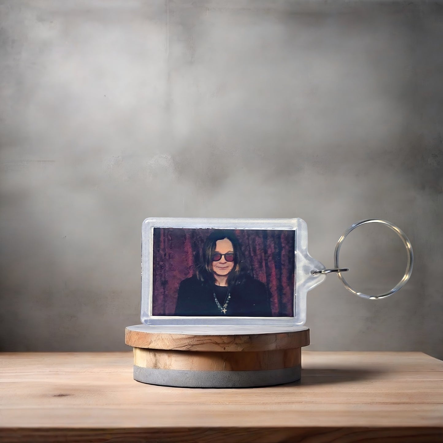 Ozzy Osbourne poster keychain with metal prints encased. Plenty to choose from