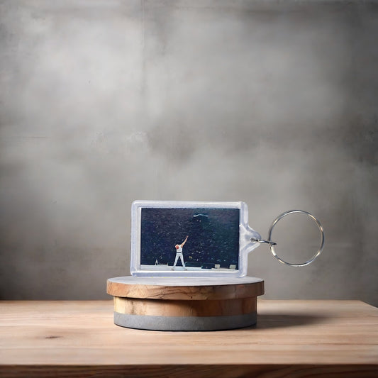 Queen Live Aid poster keychain with metal prints encased. Plenty to choose from