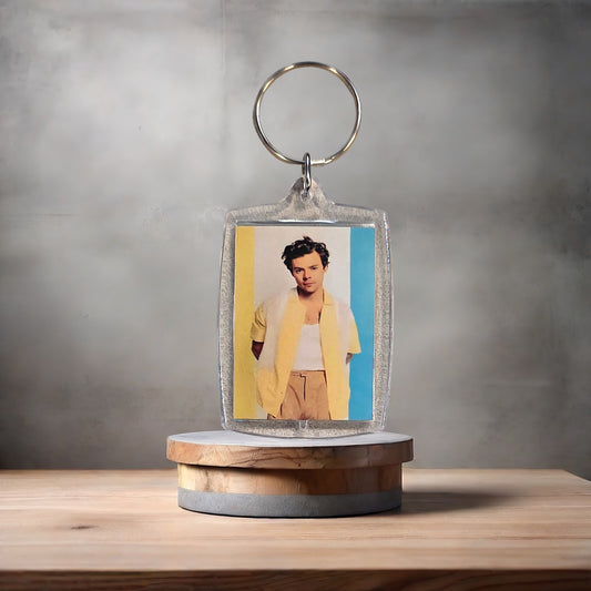 Harry Styles poster keychain on 2 aluminum prints.