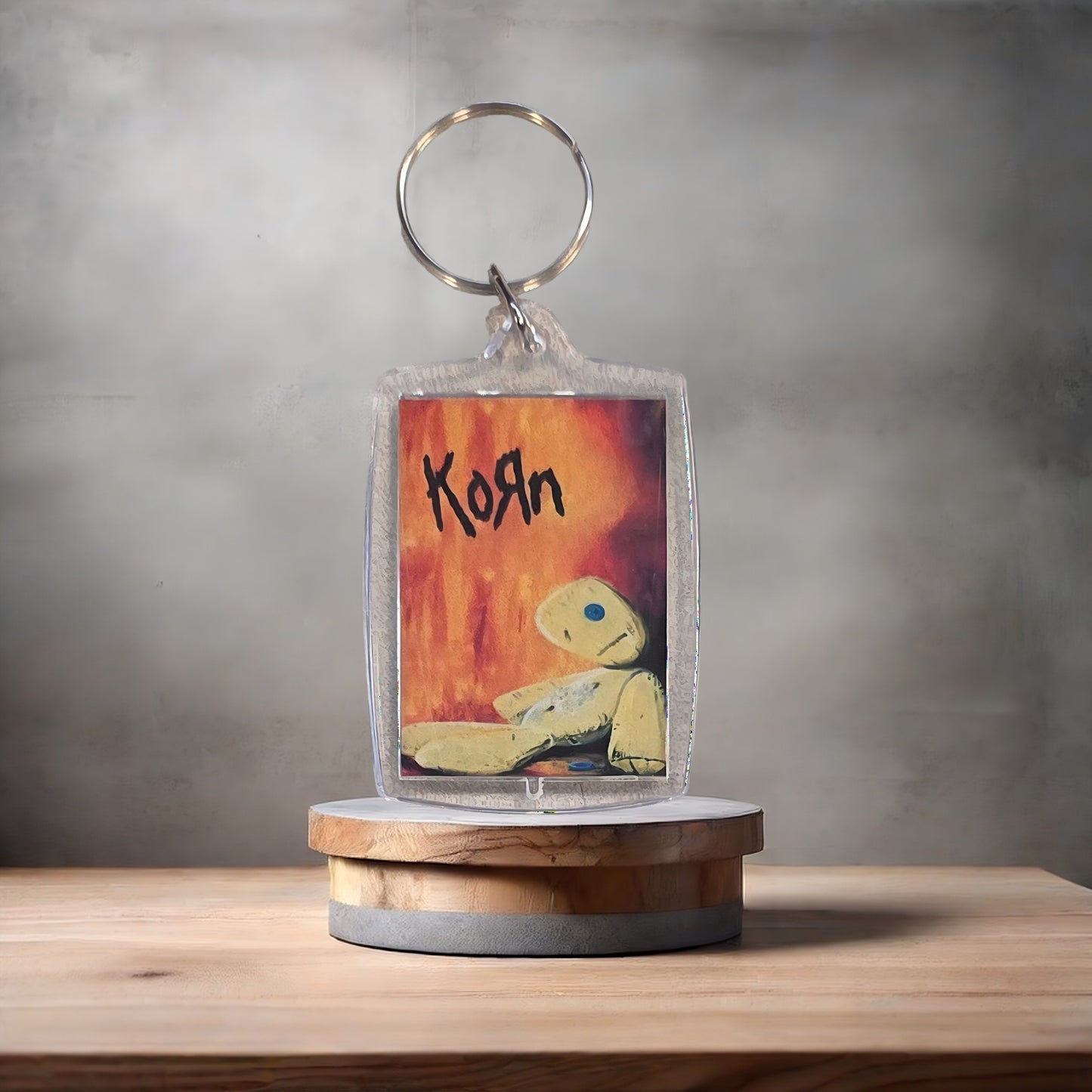 Korn poster keychain on 2 aluminum prints.