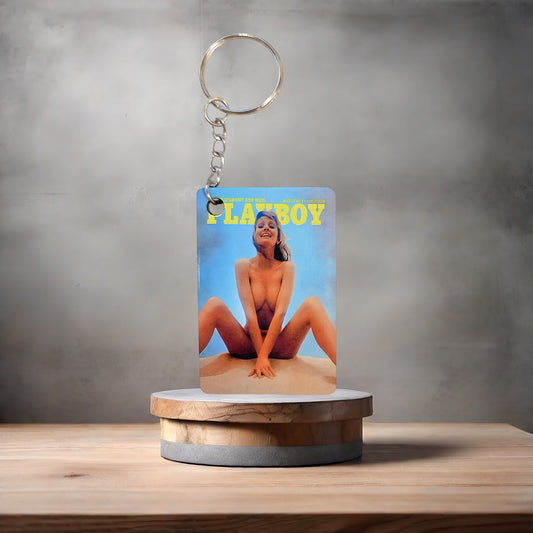 Playboy magazine cover keychain. August 1973