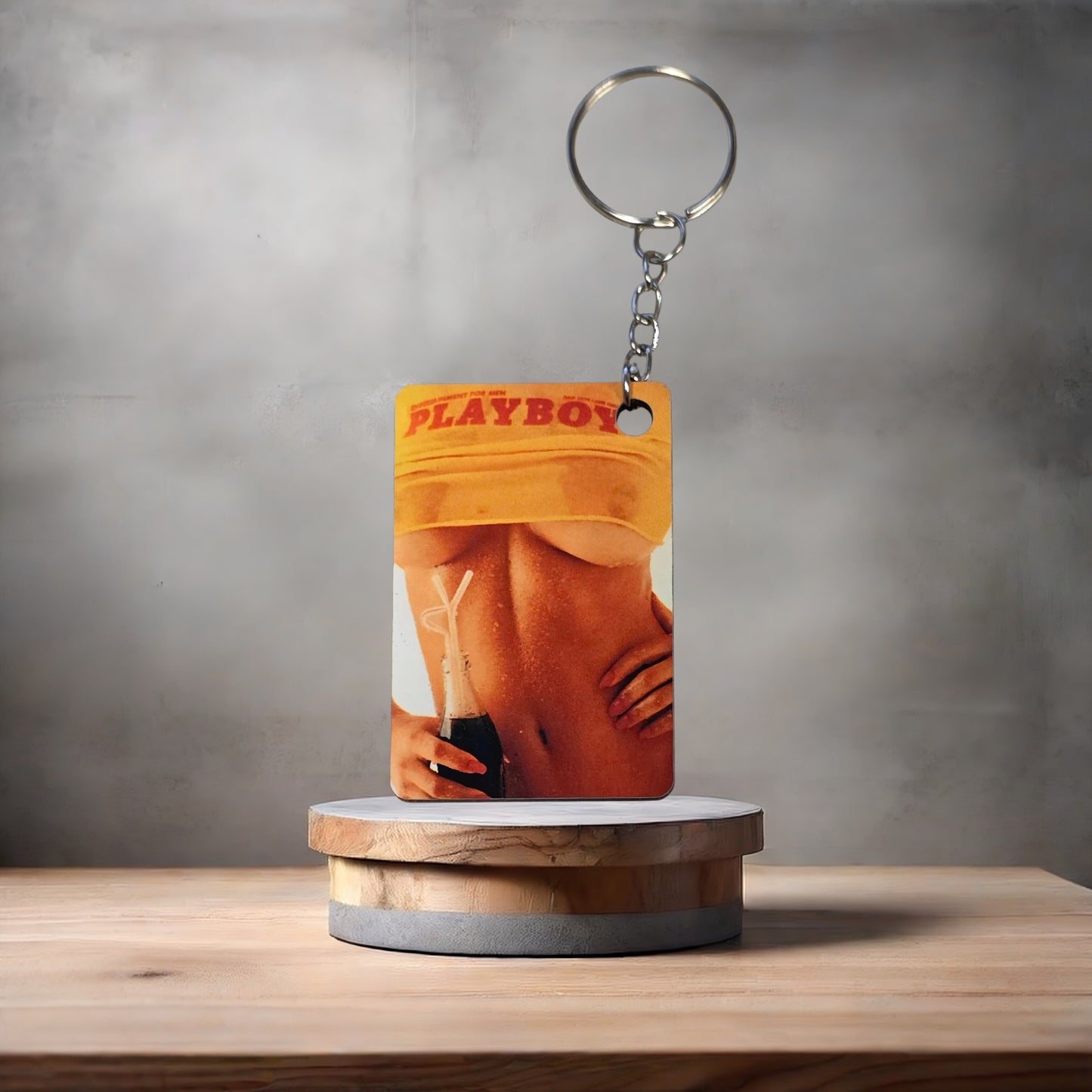 Playboy magazine cover keychain. July 1974