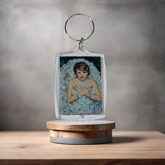 Taylor Swift keychain on aluminum prints.